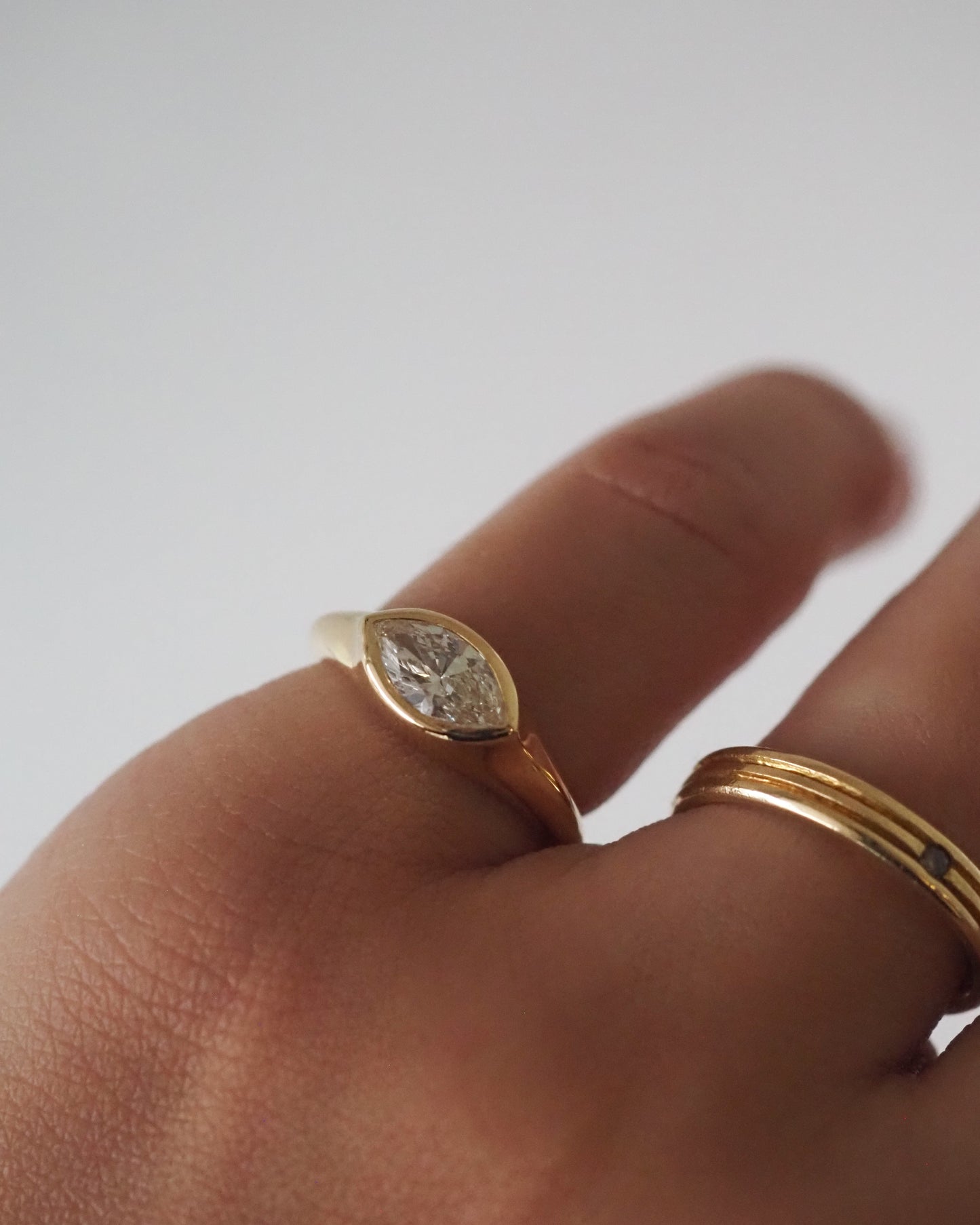 Marquise bezel east-west ring