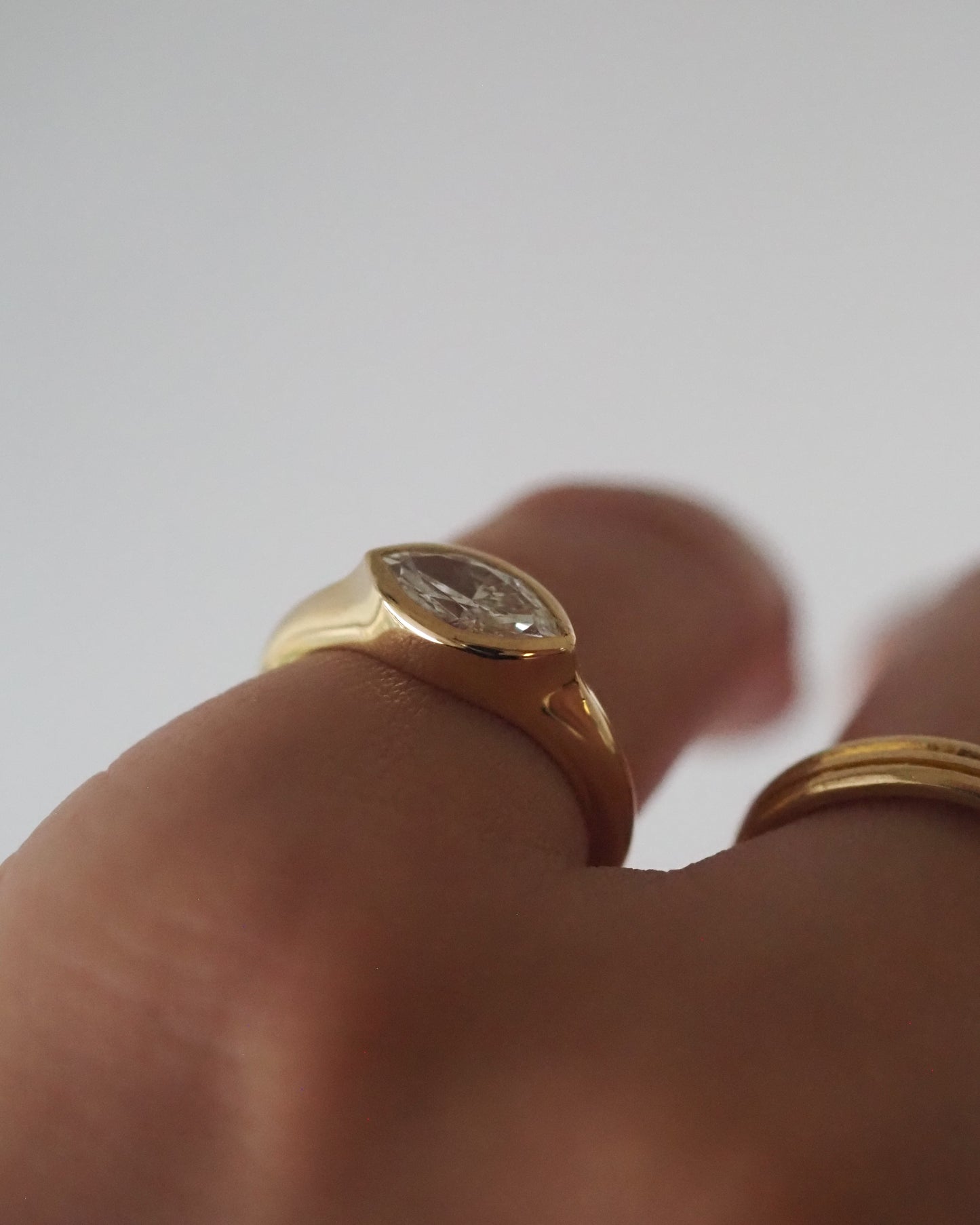 Marquise bezel east-west ring