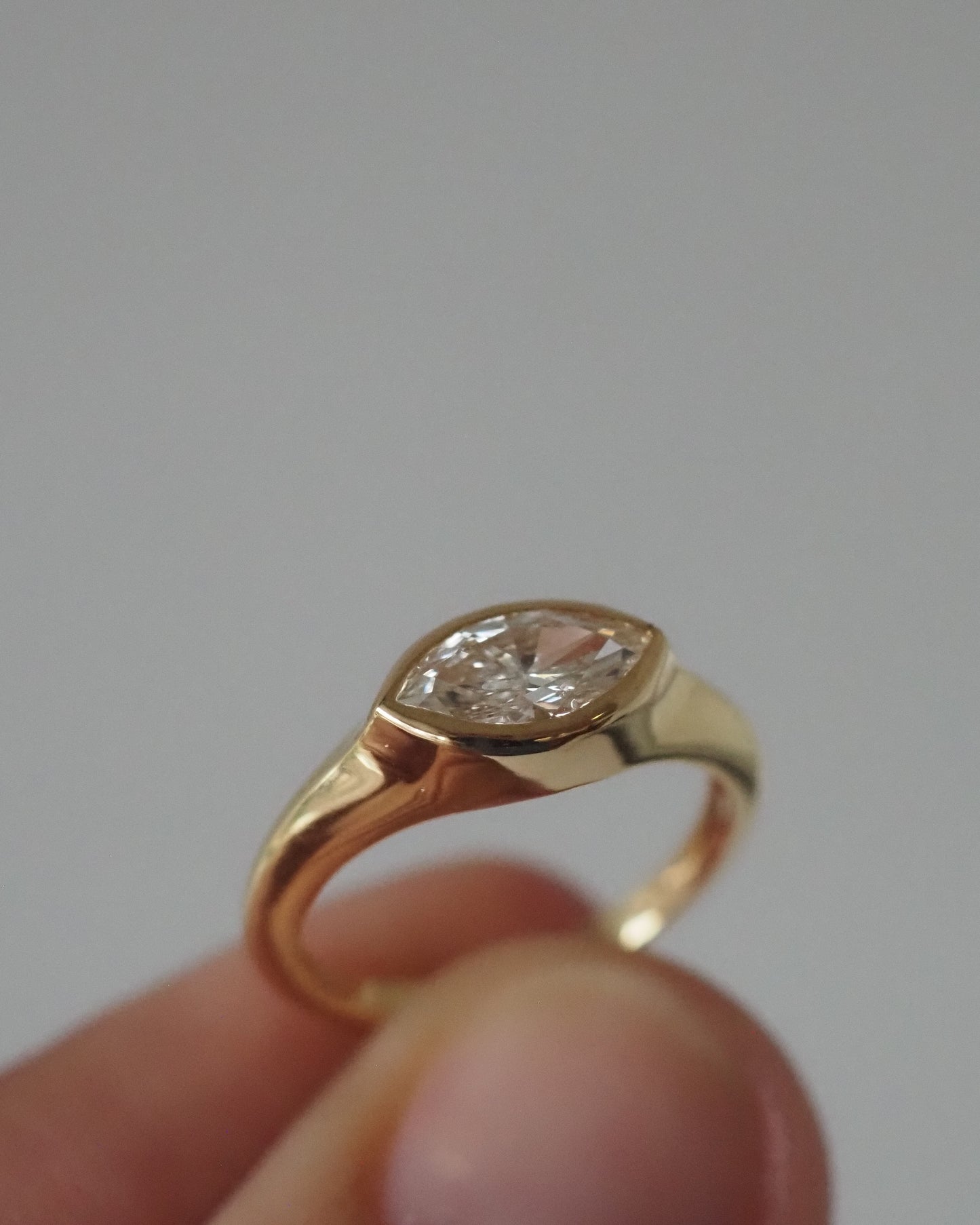 Marquise bezel east-west ring